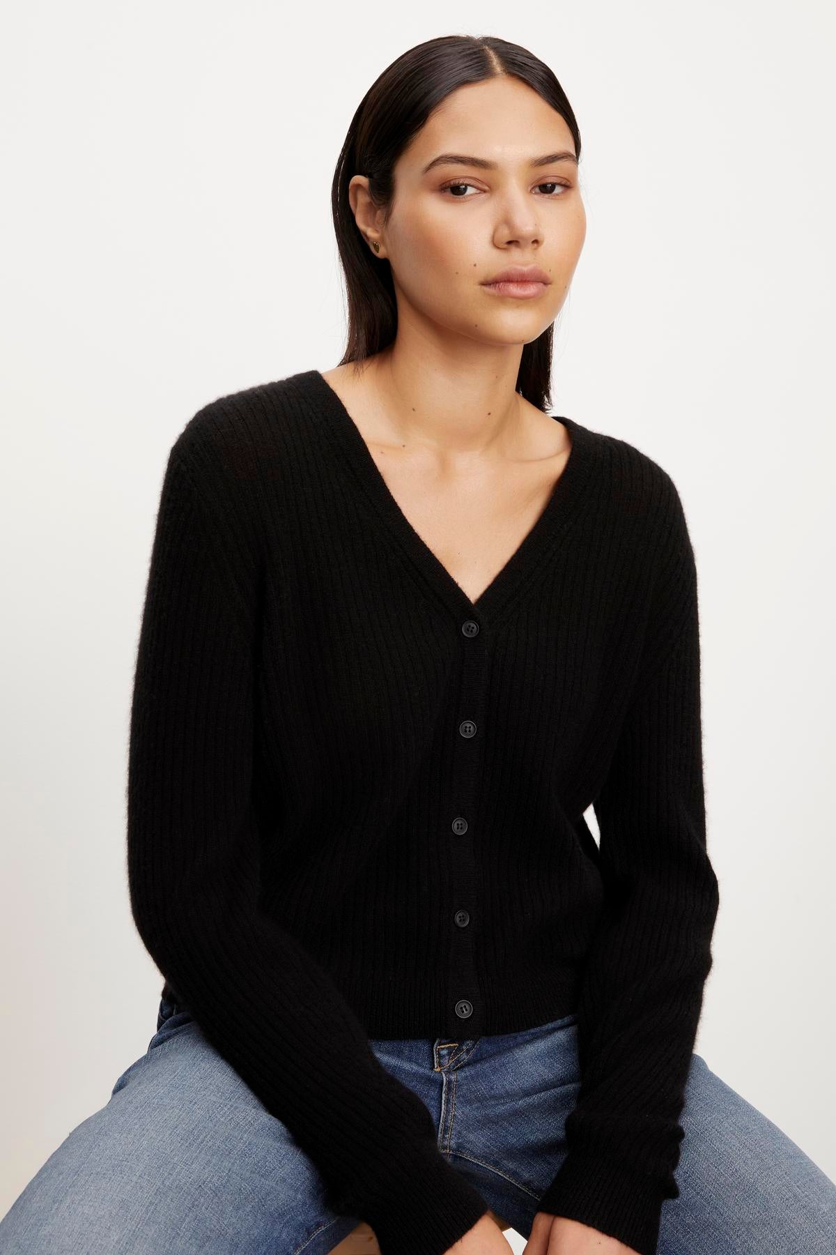 The model is wearing a Coralie Cashmere Cardigan by Velvet by Graham & Spencer.-35655685112001