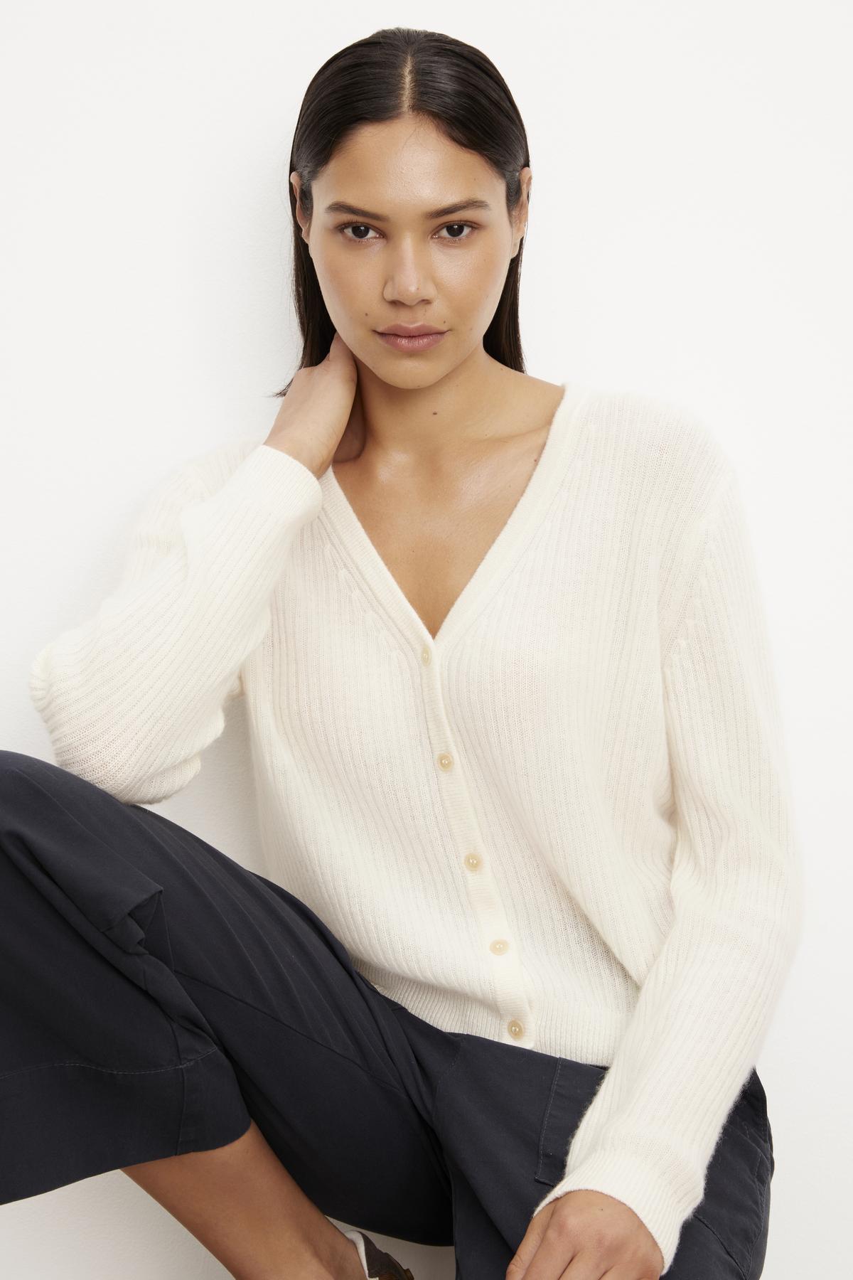 The model is wearing a Coralie Cashmere Cardigan by Velvet by Graham & Spencer and pants.-35701747515585