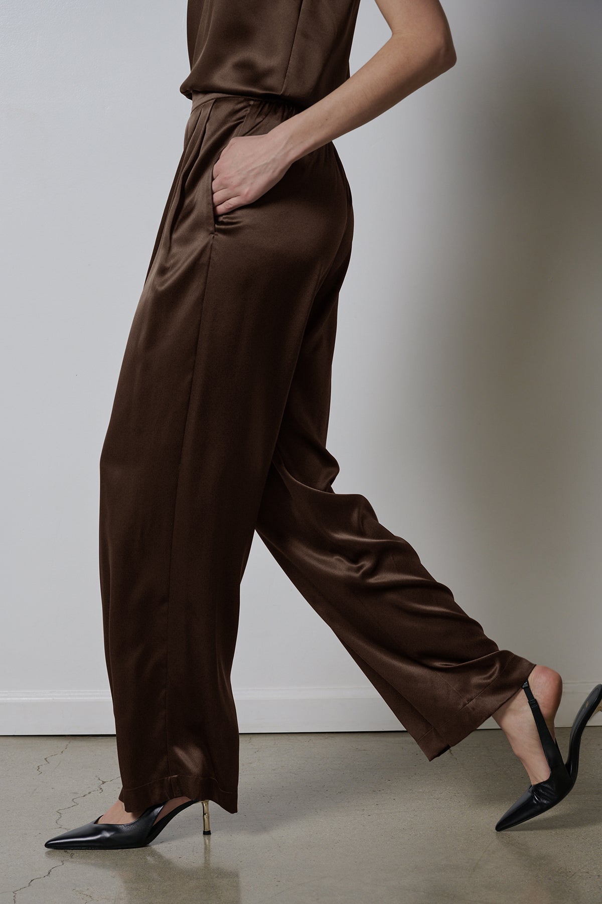   The model is wearing a brown silk Manhattan pant by Velvet by Jenny Graham. 
