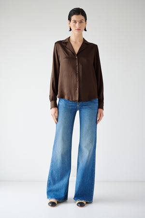 The model is wearing a timeless brown Silk Button-Up Blouse, the SOHO TOP by Velvet by Jenny Graham.
