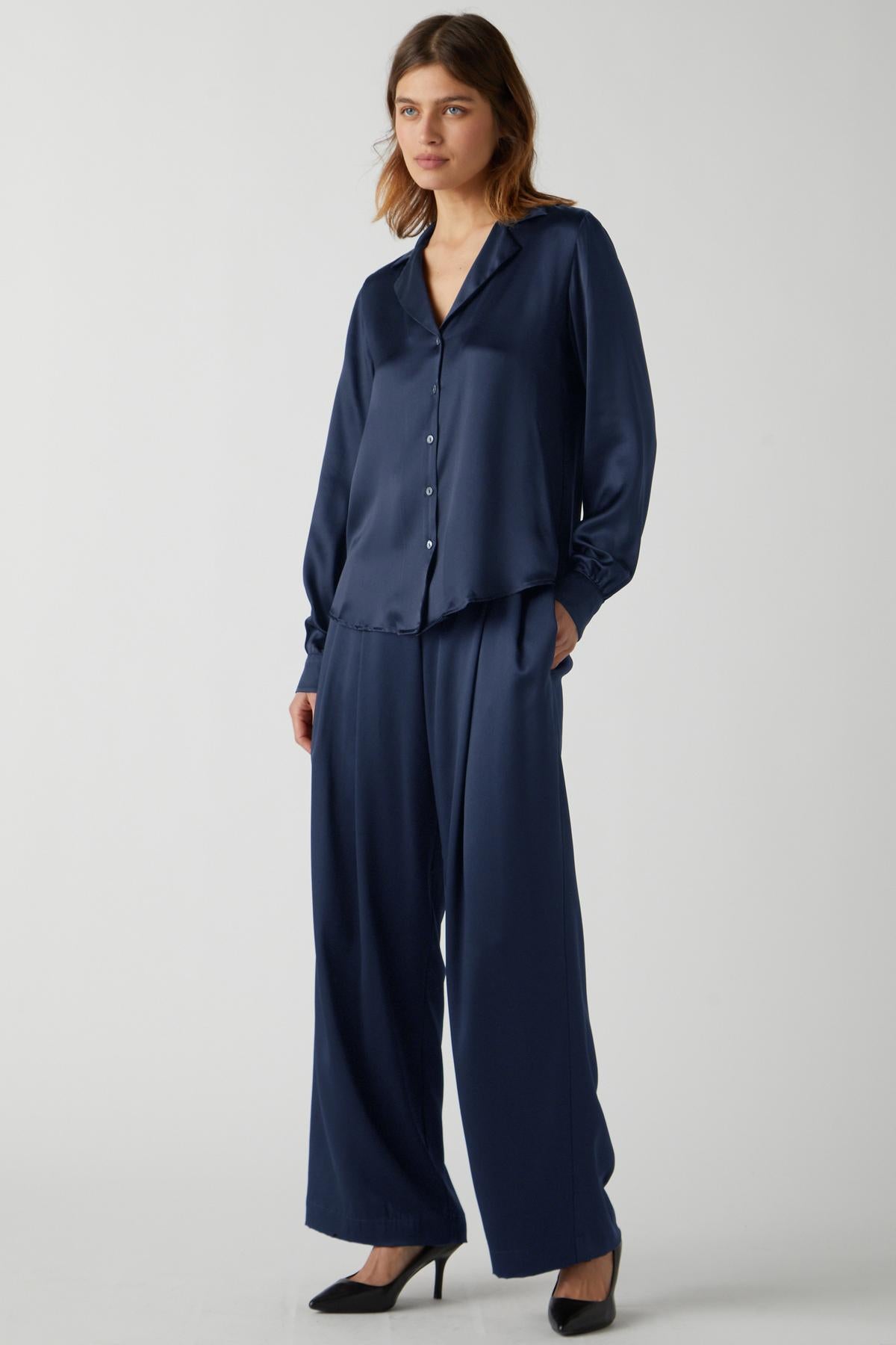 The model is wearing a Velvet by Jenny Graham SOHO TOP and wide leg pants.-35548175073473
