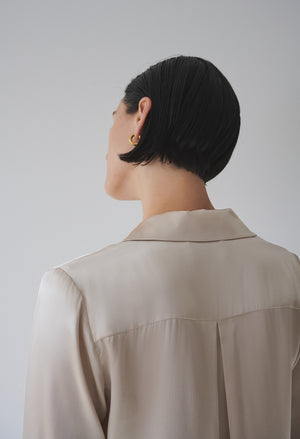 The back view of a woman wearing a Velvet by Jenny Graham SOHO TOP.