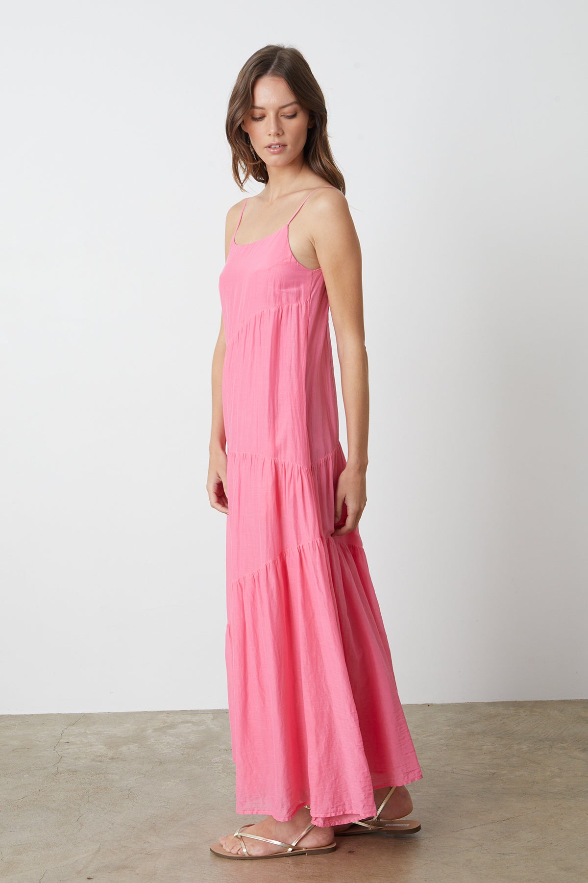 The model is wearing a pink Velvet by Graham & Spencer BILLIE TIERED MAXI DRESS.-26342686326977