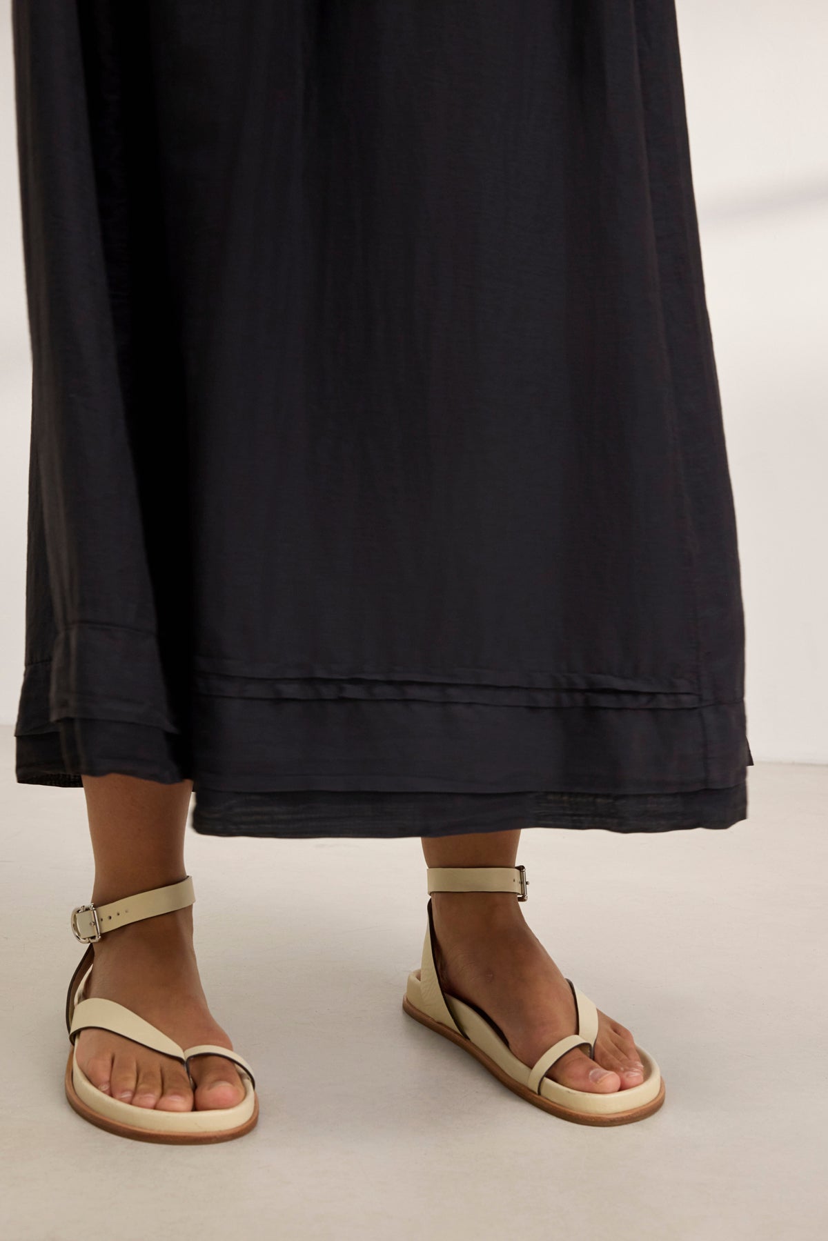 Dressed in a BAYOU SILK COTTON VOILE DRESS by Velvet by Graham & Spencer, paired with beige ankle strap sandals, this ensemble epitomizes versatile style as it rests effortlessly on a light surface.-38801130782913