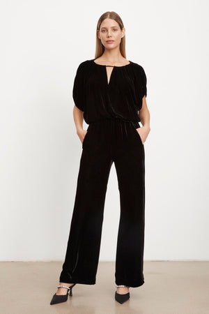 A model wearing the FRIDA SILK VELVET WIDE LEG PANT by Velvet by Graham & Spencer with an elastic waistband.