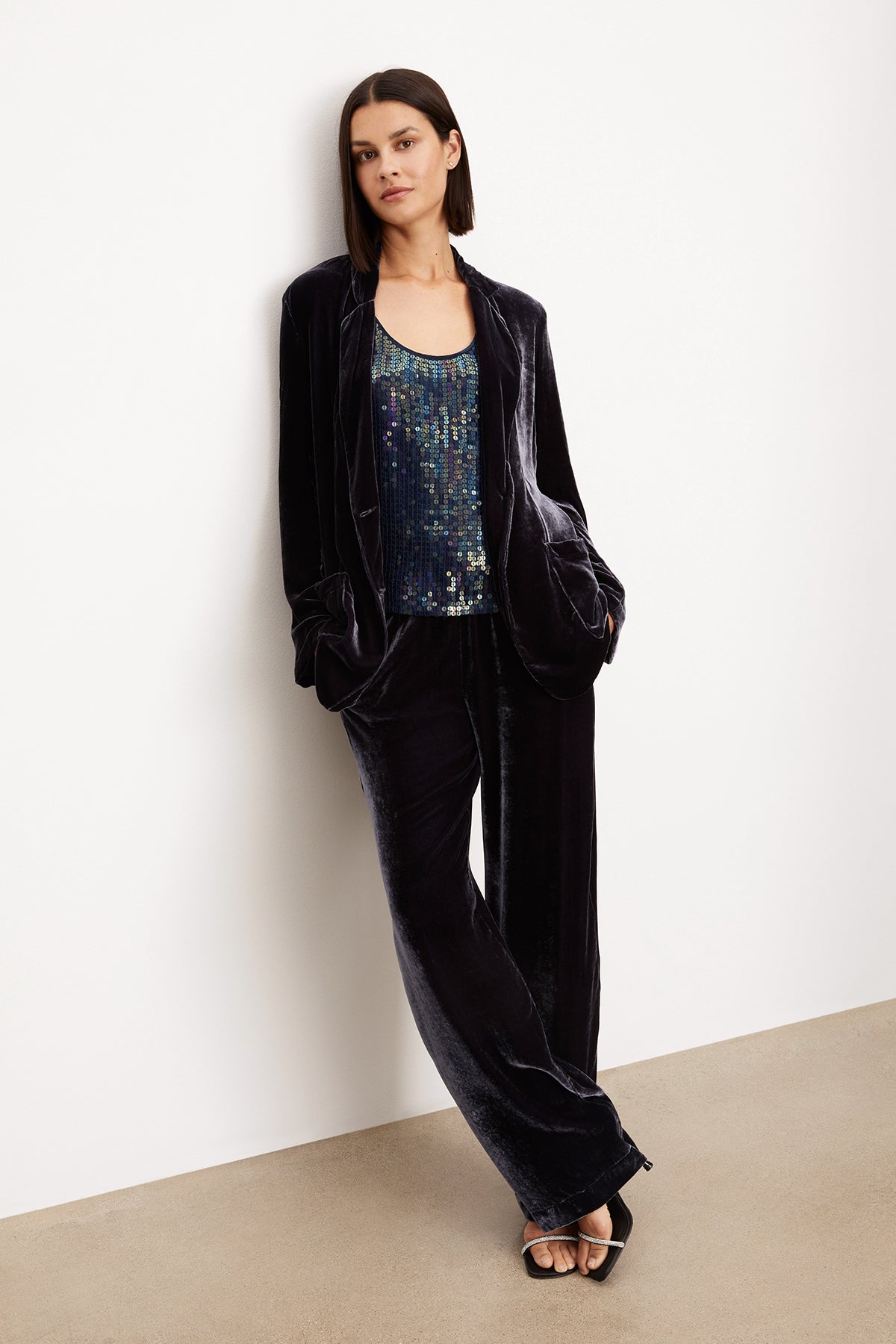 A woman wearing a FRIDA SILK VELVET WIDE LEG PANT by Velvet by Graham & Spencer jacket and trousers with an elastic waistband.-35577756221633