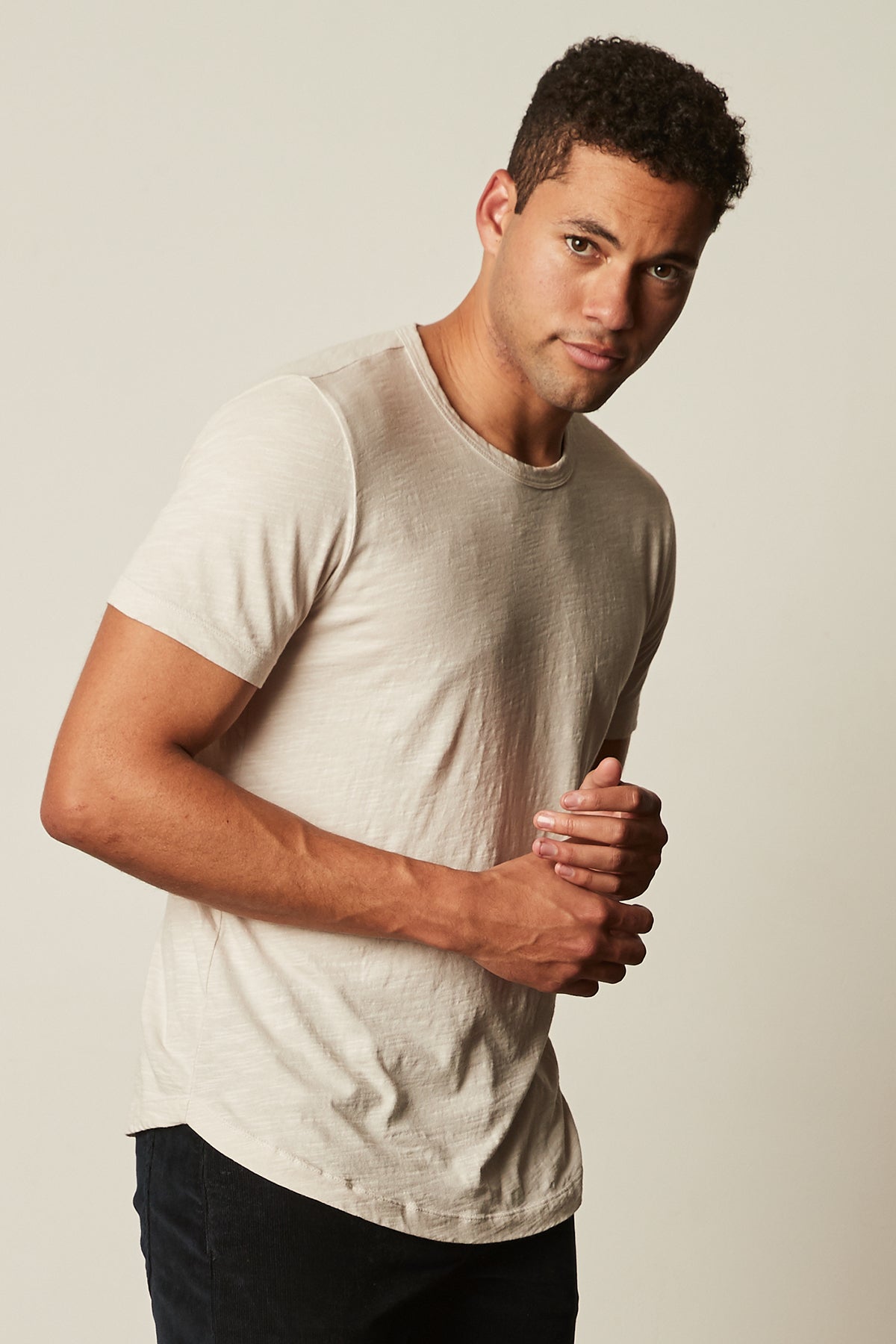 A man in a Velvet by Graham & Spencer AMARO CREW NECK SLUB TEE is posing for a photo.-35207081656513