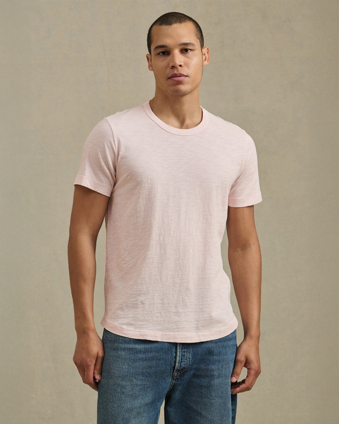 A man in studio wearing the Amaro Tee in Scallop by Velvet by Graham & Spencer.