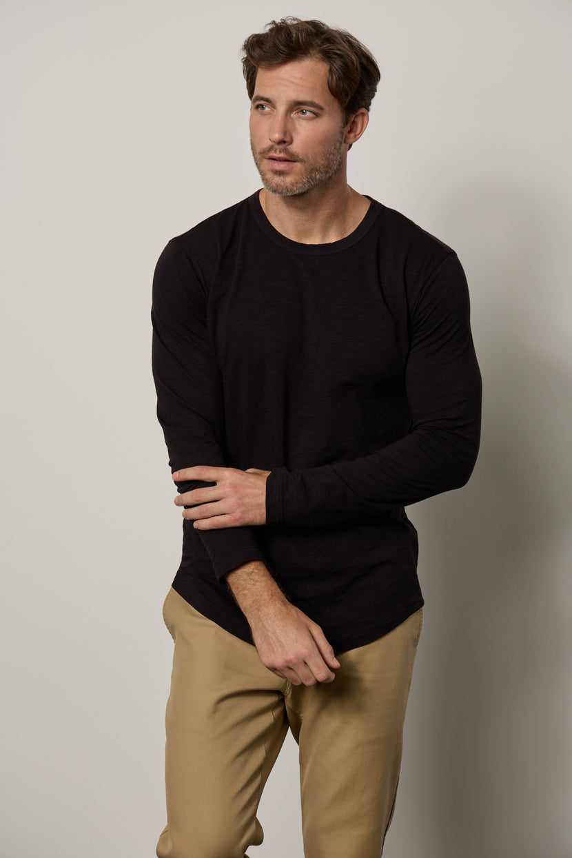 A man wearing the Velvet by Graham & Spencer KAI CREW NECK TEE.