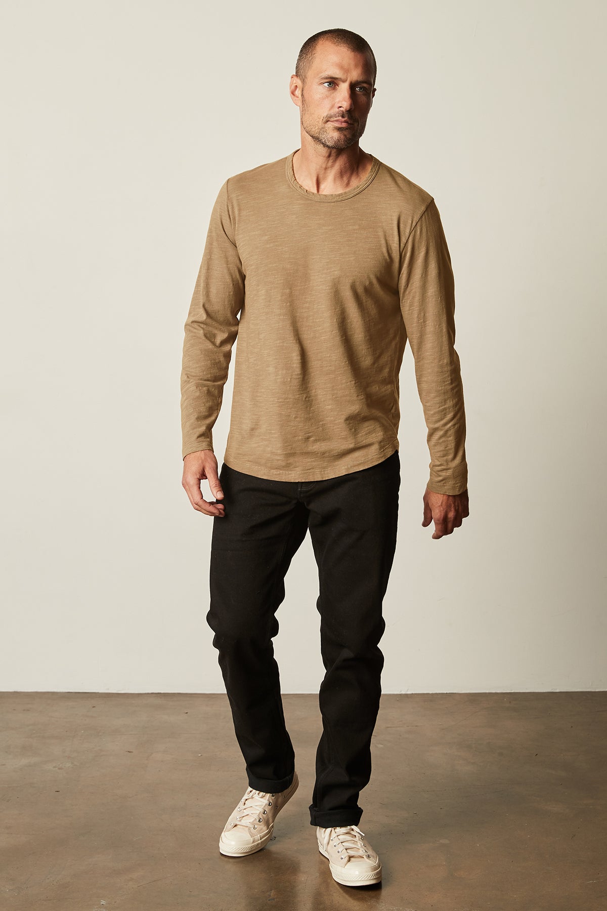 Kai Crew Neck Long Sleeve Tee in camel color with black denim full length front-26630571327681