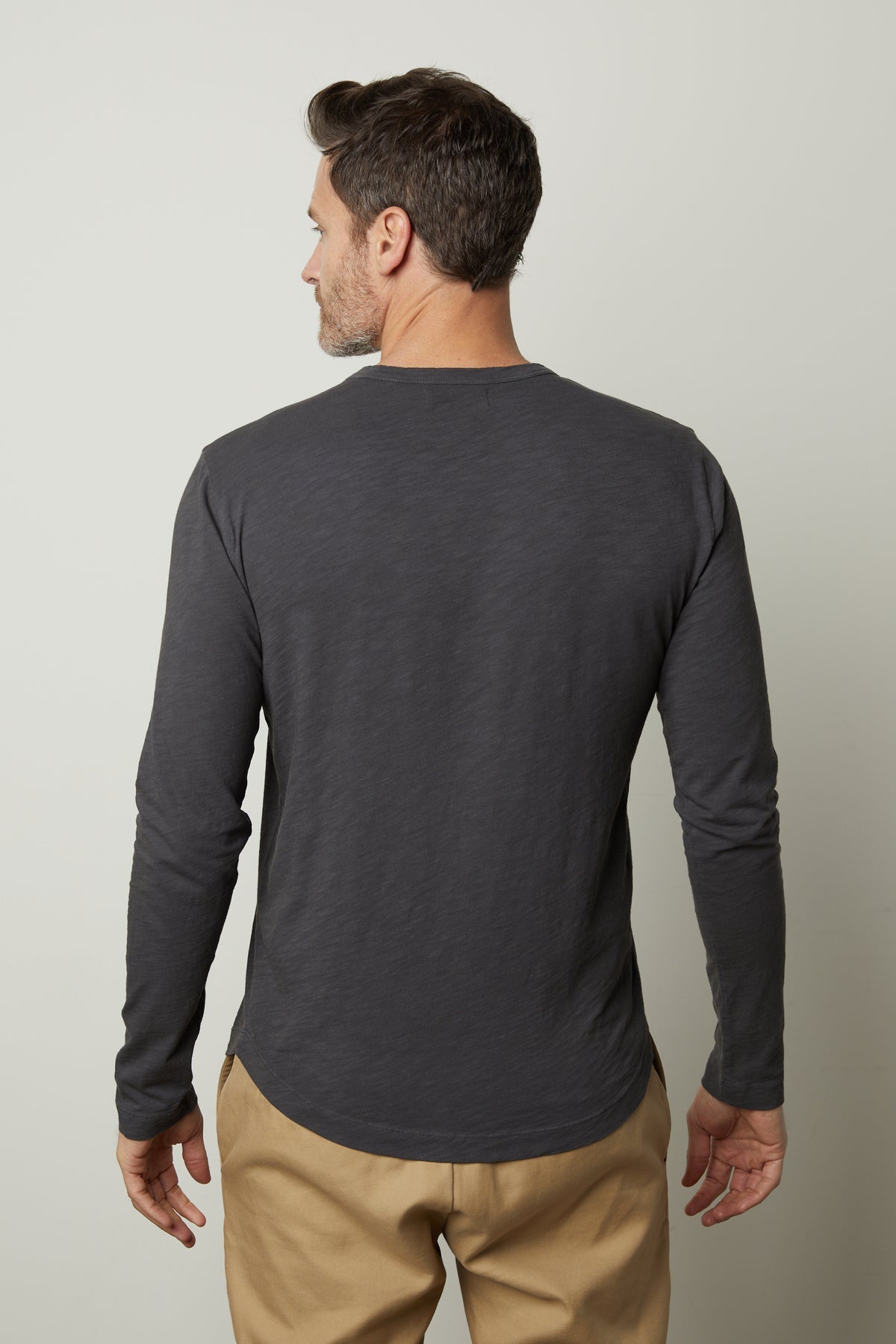 The back view of a man wearing a Velvet by Graham & Spencer KAI CREW NECK TEE.-35782958743745
