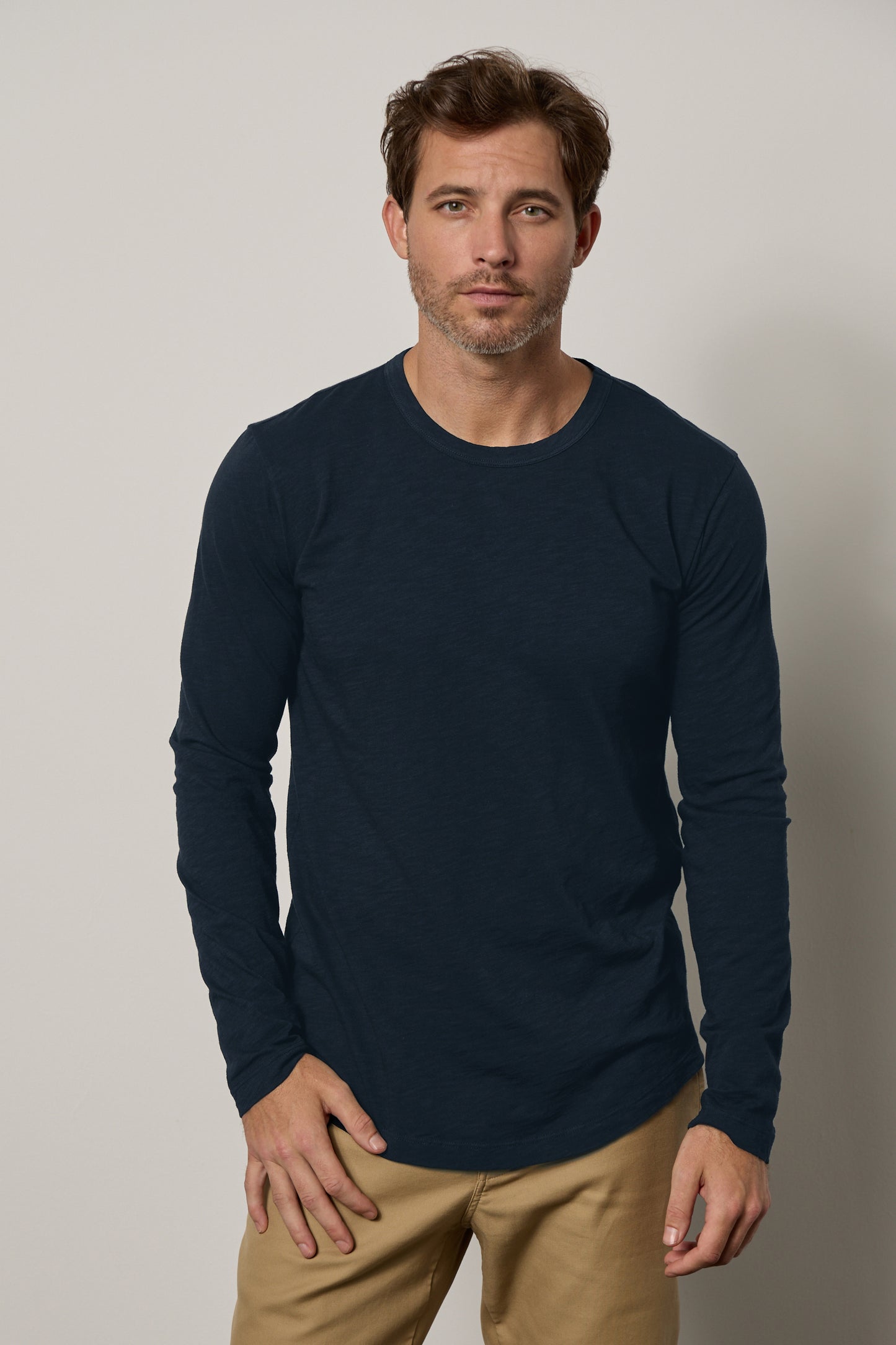 A man wearing a flawless fit Velvet by Graham & Spencer KAI CREW NECK TEE navy long sleeve t-shirt.-35607579197633