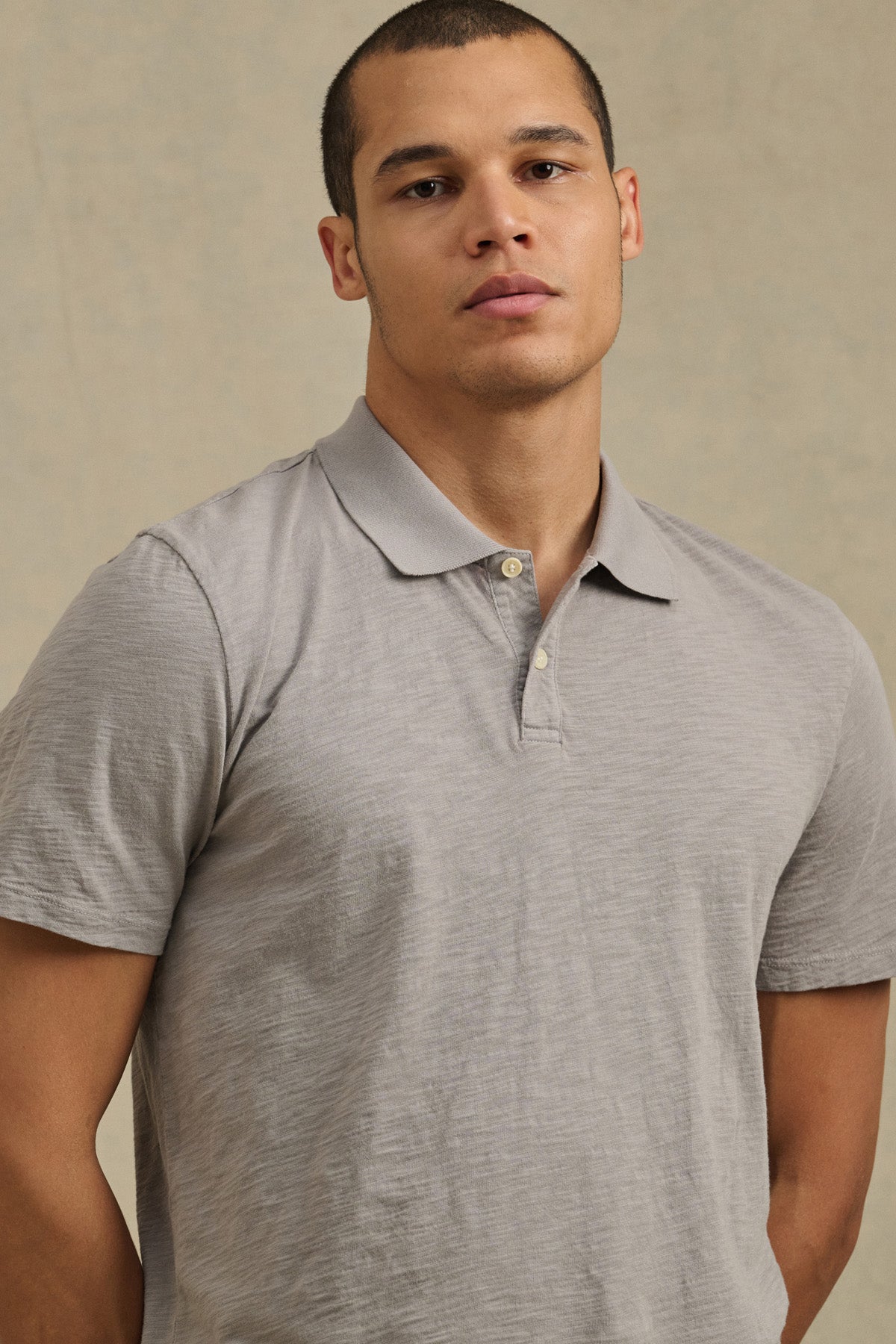 Wearing the Velvet by Graham & Spencer MORRIS POLO in light gray, a person stands against a neutral background, facing the camera.-41338470990017