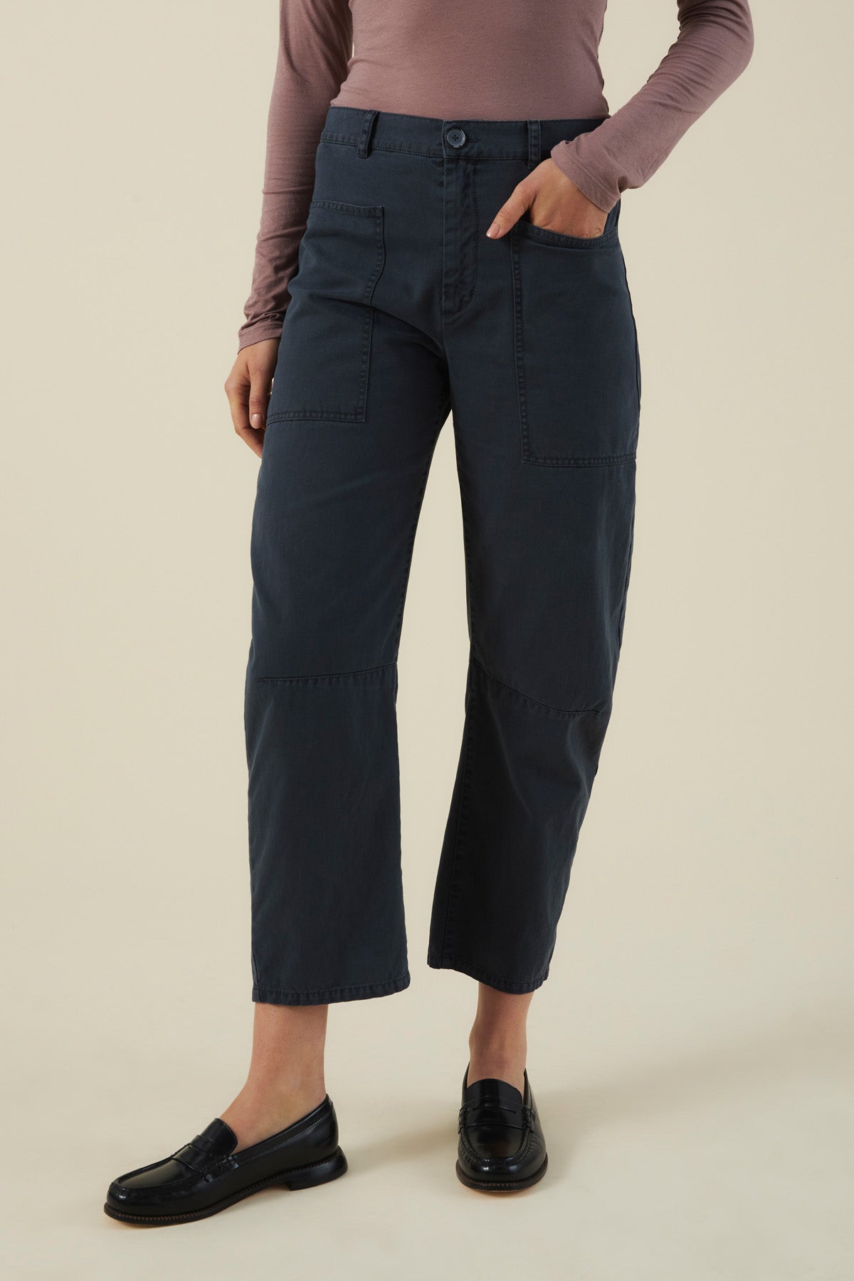 Dark navy cotton twill BRYLIE PANT with front patch pockets and a mid-rise barrel leg, paired with black loafers.