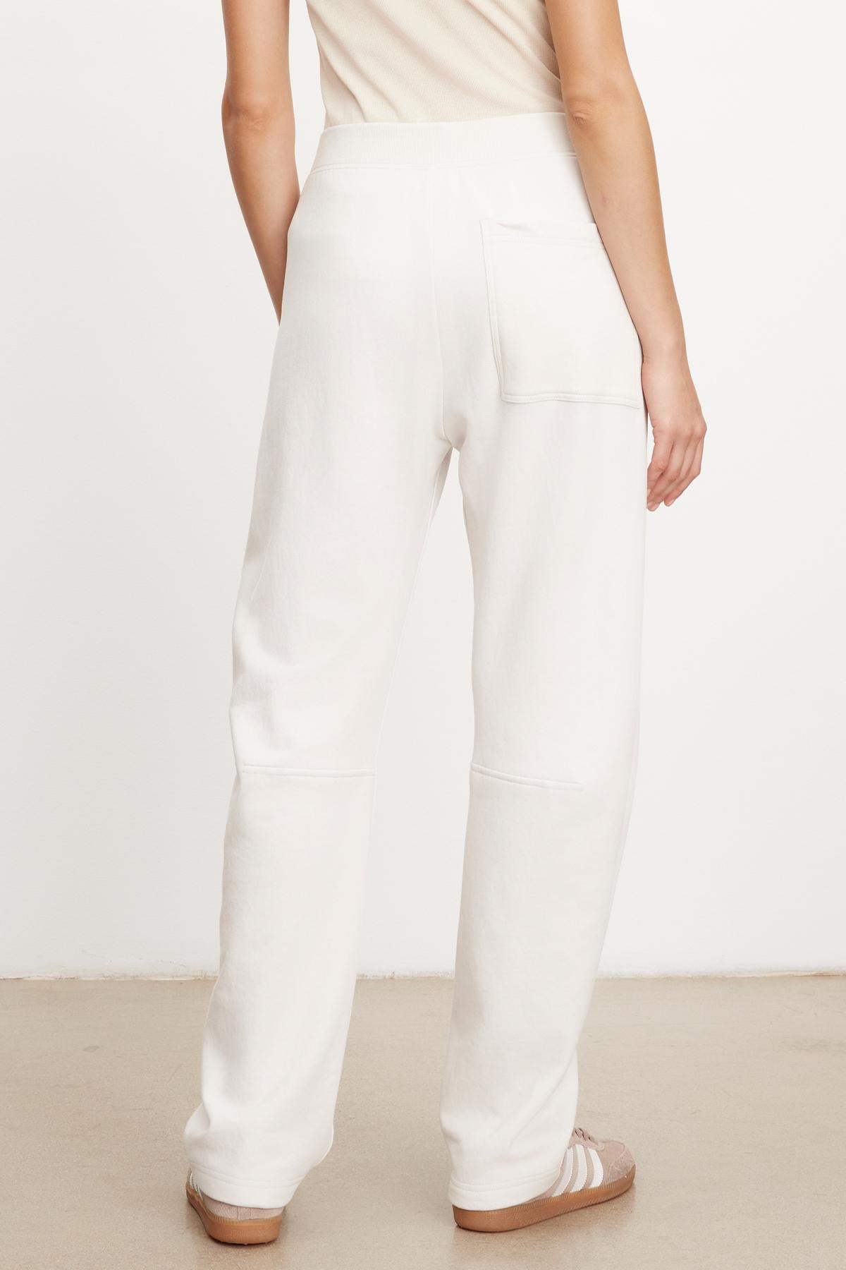 The view of a woman wearing MATTY SOFT FLEECE SWEATPANT by Velvet by Graham & Spencer.-35696184230081