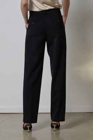 The back view of a person wearing BUNDY PANT trousers by Velvet by Jenny Graham.