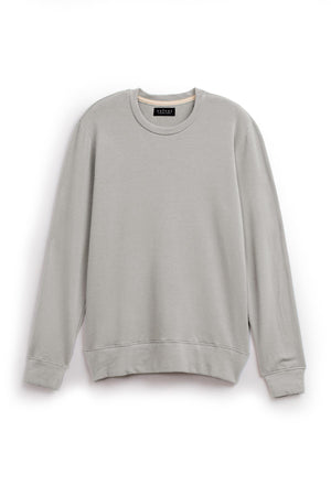 The SOREN PULLOVER by Velvet by Graham & Spencer is a plain gray sweatshirt featuring a crew neck and long sleeves, designed with an extra soft luxe fleece for ultimate comfort and a cozy brushed interior, all showcased on a white background.