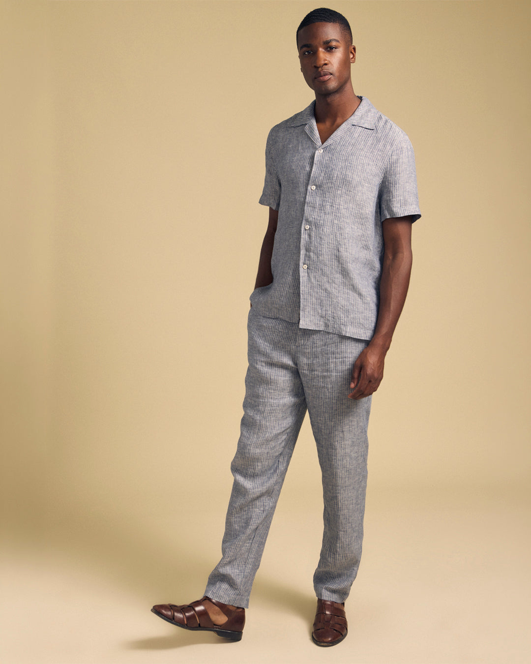 A man wearing the Jae Pant in Indigo by Velvet by Graham & Spencer.