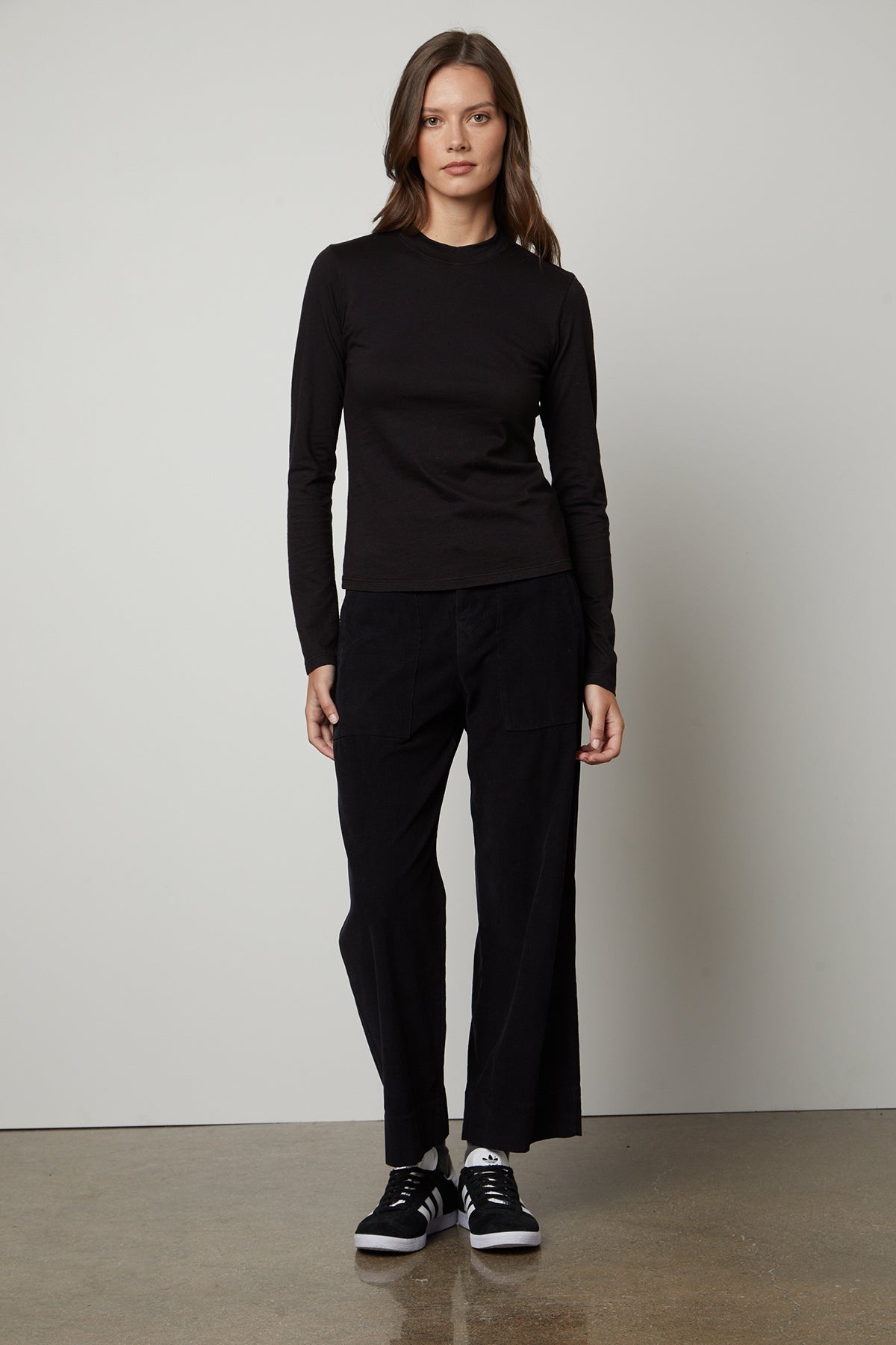   The model is wearing the VERA CORDUROY WIDE LEG PANT by Velvet by Graham & Spencer. 