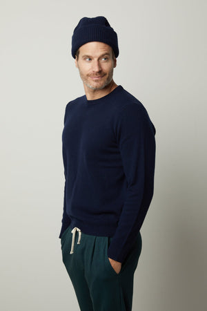 A man sporting a classic Velvet by Graham & Spencer DASHELL CREW NECK SWEATER exudes style and warmth.