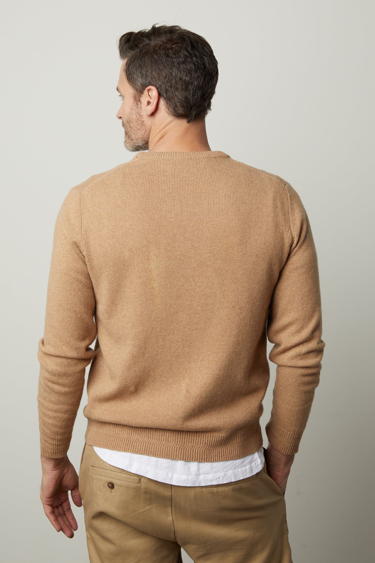 The stylish back view of a man wearing a warm Velvet by Graham & Spencer DASHELL CREW NECK SWEATER.-35782497206465