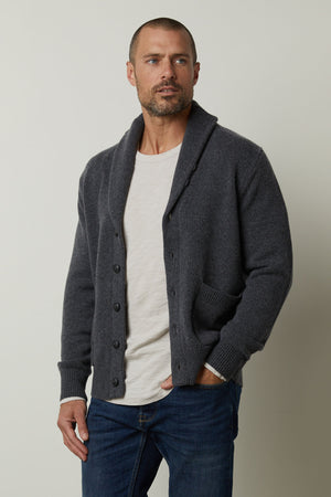 A man wearing a Velvet by Graham & Spencer Thornton Button Front Cardigan achieved a polished appearance.