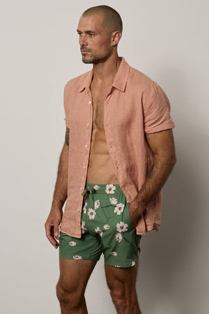 Ricardo Swim Short in print with green background and bold white floral with Mackie Shirt unbuttoned in bronze