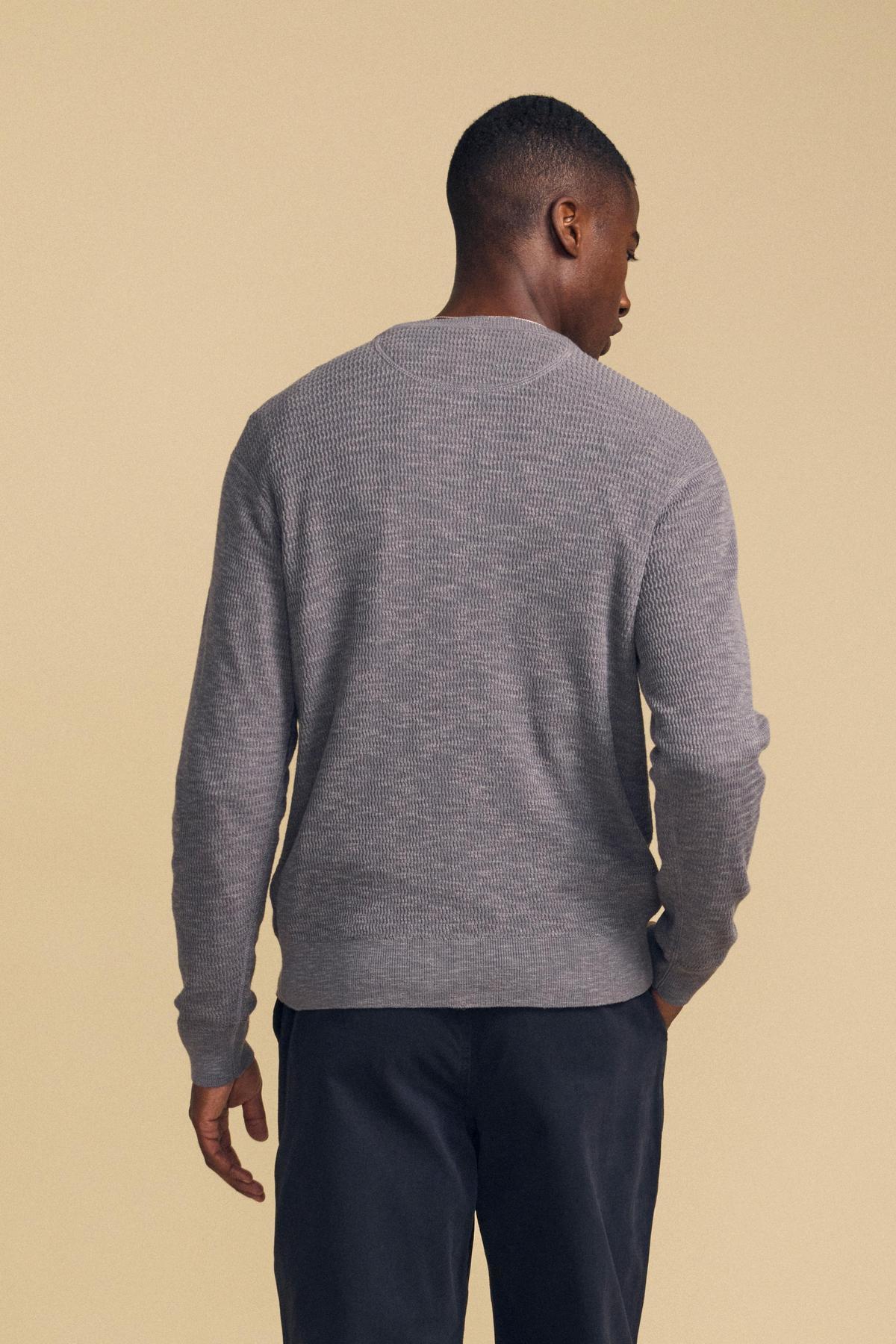 Back view of a person wearing a grey long-sleeved textured crewneck CONOR SWEATER by Velvet by Graham & Spencer.