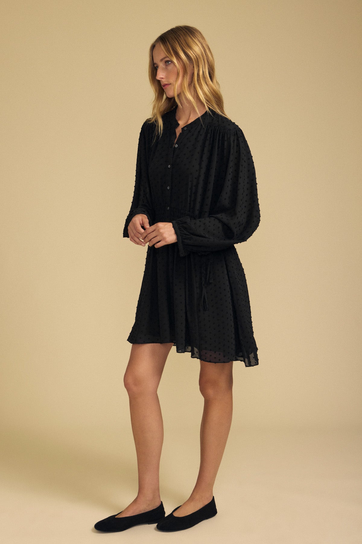 Velvet by Graham & Spencer BRINLEY TEXTURED CREPE DRESS, a black long-sleeved mini dress in textured crepe with a button-down bodice, styled for holiday parties with black ballet flats.-46488136974529