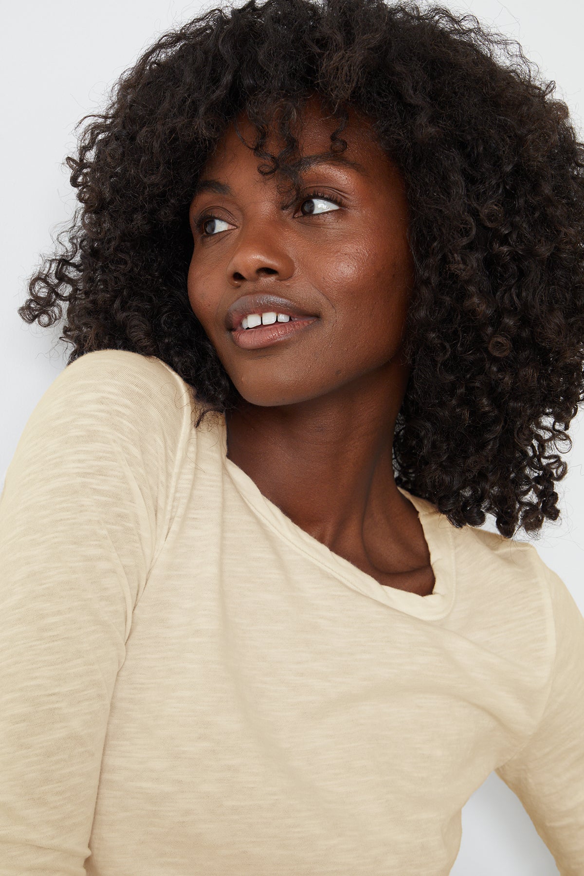 a woman wearing a Velvet by Graham & Spencer LIZZIE ORIGINAL SLUB LONG SLEEVE TEE.-26630740541633