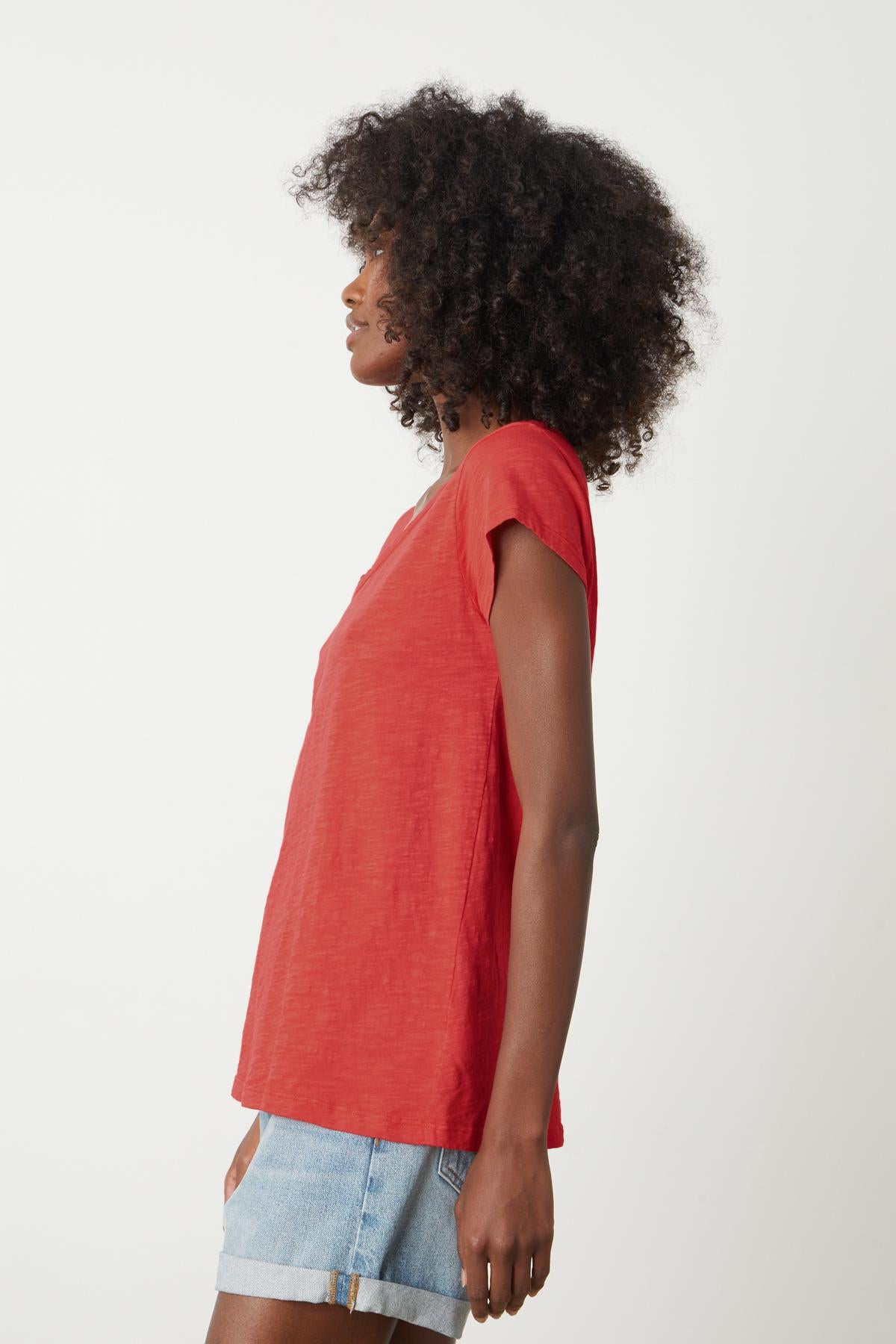 A woman wearing a Velvet by Graham & Spencer KIRA ORIGINAL SLUB SCOOP NECK TEE and shorts.-35201184399553