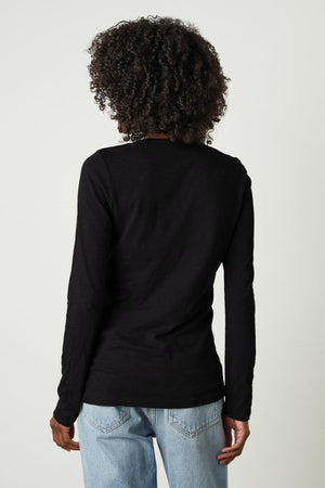 The back view of a person wearing a Velvet by Graham & Spencer BLAIRE ORIGINAL SLUB TEE, a forever piece.