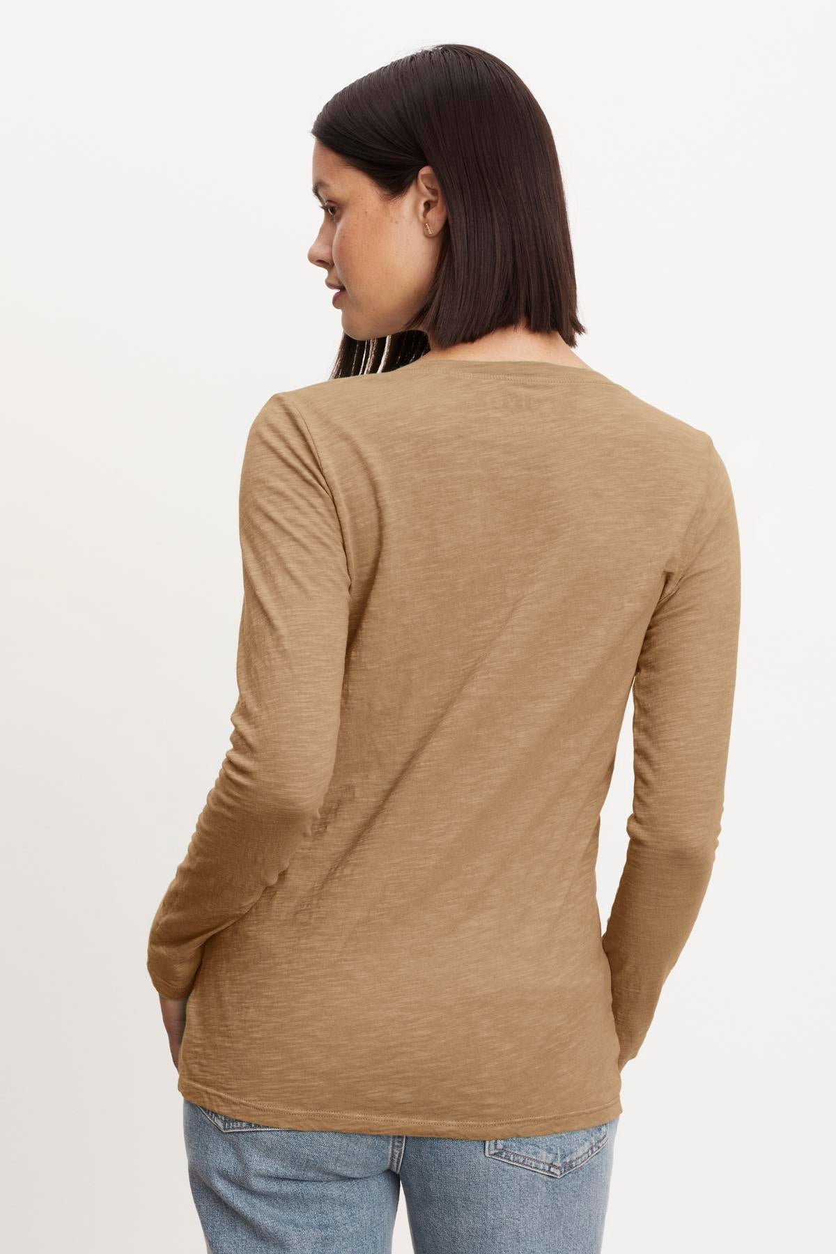 The back view of a woman wearing a Velvet by Graham & Spencer BLAIRE ORIGINAL SLUB TEE.-35782759121089