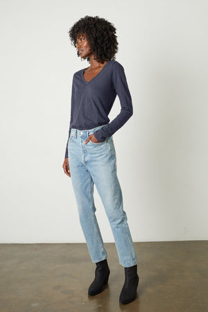 Blaire Original Slub Long Sleeve Tee in crater blue tucked into light blue denim with black boots full length front view.