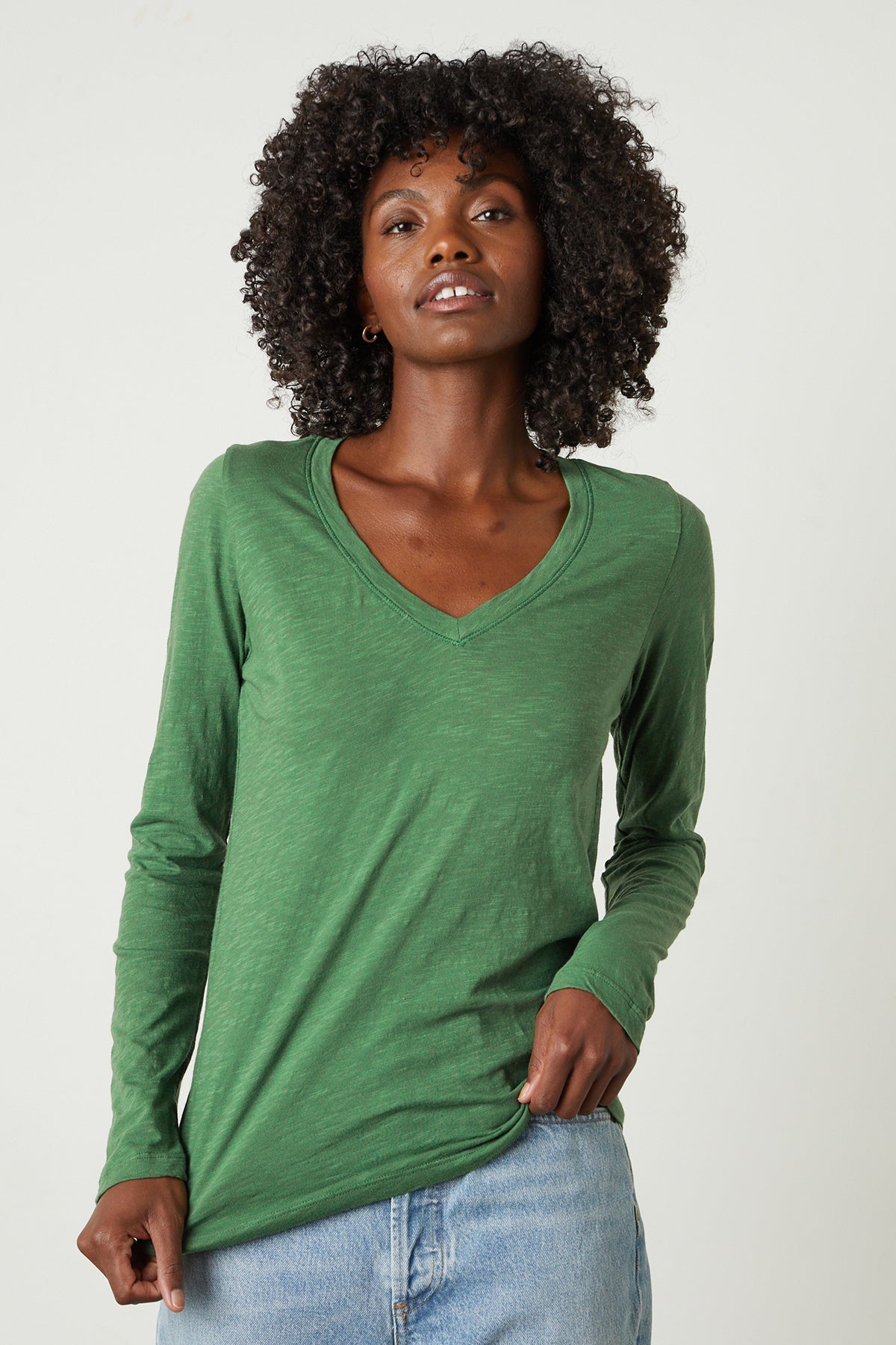 a woman wearing a green Velvet by Graham & Spencer BLAIRE ORIGINAL SLUB TEE.-26630140690625
