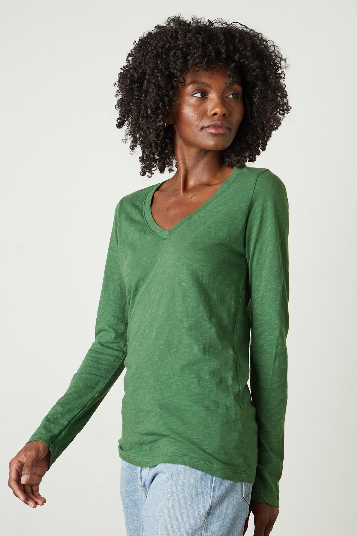   a woman wearing a green Blaire Original Slub Tee by Velvet by Graham & Spencer. 