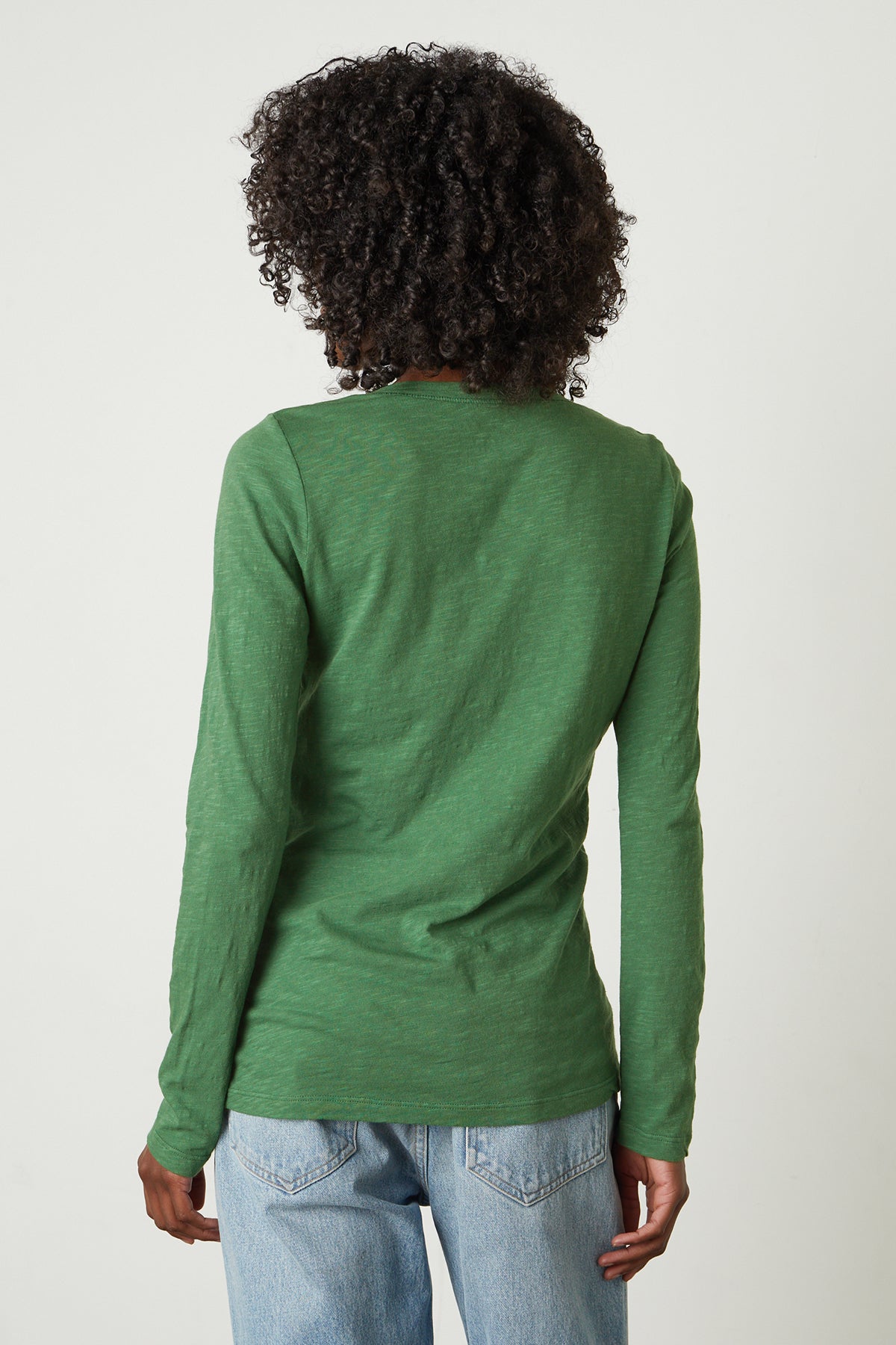The back view of a woman wearing a Velvet by Graham & Spencer BLAIRE ORIGINAL SLUB TEE.-26630140723393
