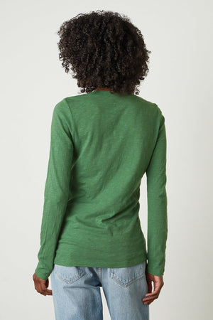 The back view of a woman wearing a Velvet by Graham & Spencer BLAIRE ORIGINAL SLUB TEE.