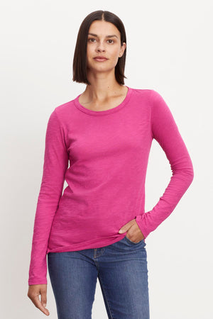 A woman wearing a LIZZIE ORIGINAL SLUB LONG SLEEVE TEE by Velvet by Graham & Spencer in cotton.