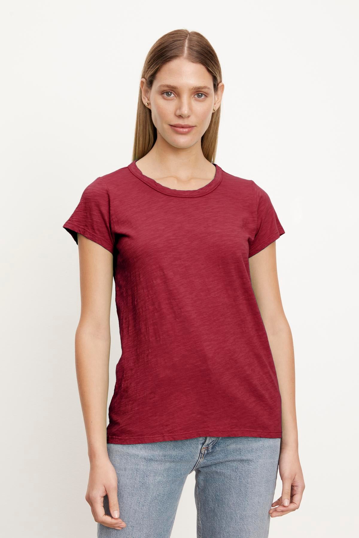 A woman wearing a Velvet by Graham & Spencer burgundy TILLY ORIGINAL SLUB CREW NECK TEE t-shirt.-26883540287681
