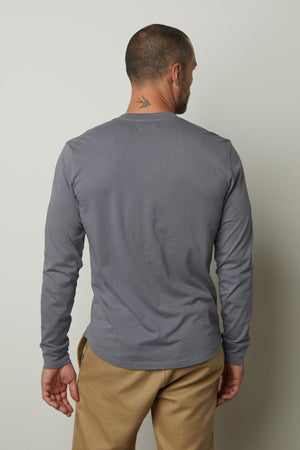 The back view of a man in a Grey BRADEN HENLEY shirt made of cotton fabric by Velvet by Graham & Spencer.