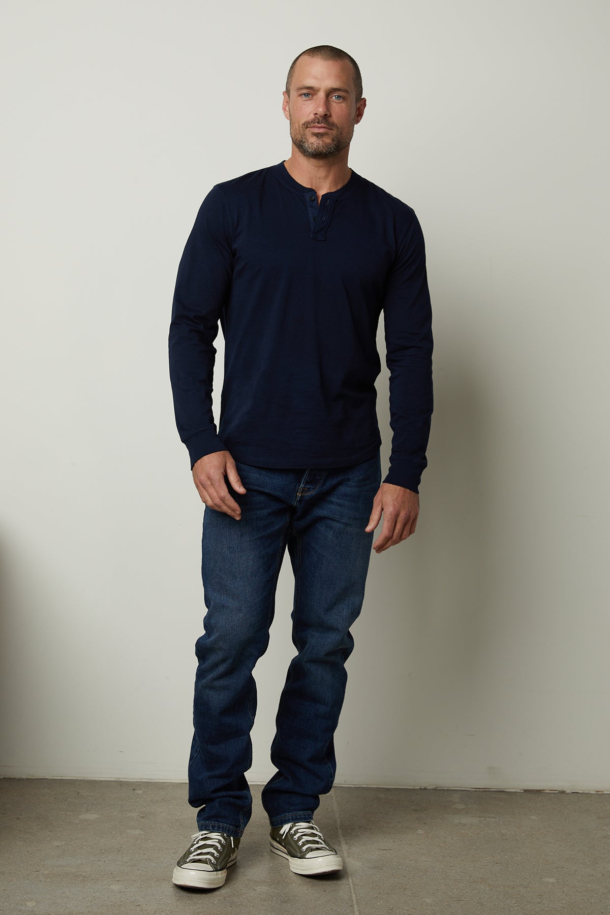   Braden Long Sleeve Henley in midnight front view with denim and sneakers 