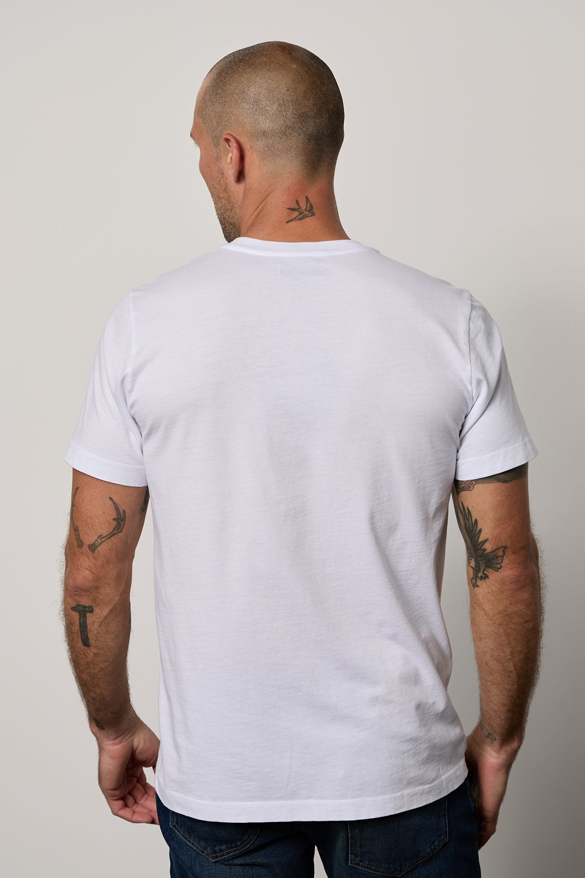   The back of a man wearing a Velvet by Graham & Spencer MARSHALL V-NECK TEE. 