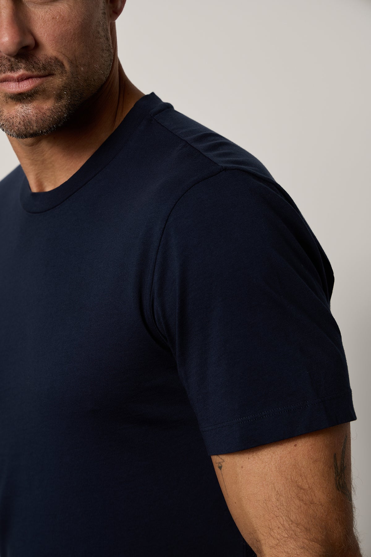 a man wearing a Velvet by Graham & Spencer RANDY CREW NECK TEE t - shirt.-35755370741953