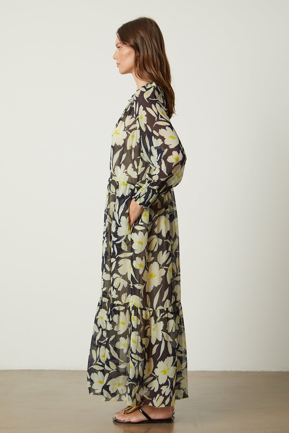   The back view of a woman wearing the Velvet by Graham & Spencer Serena Printed Maxi Dress. 