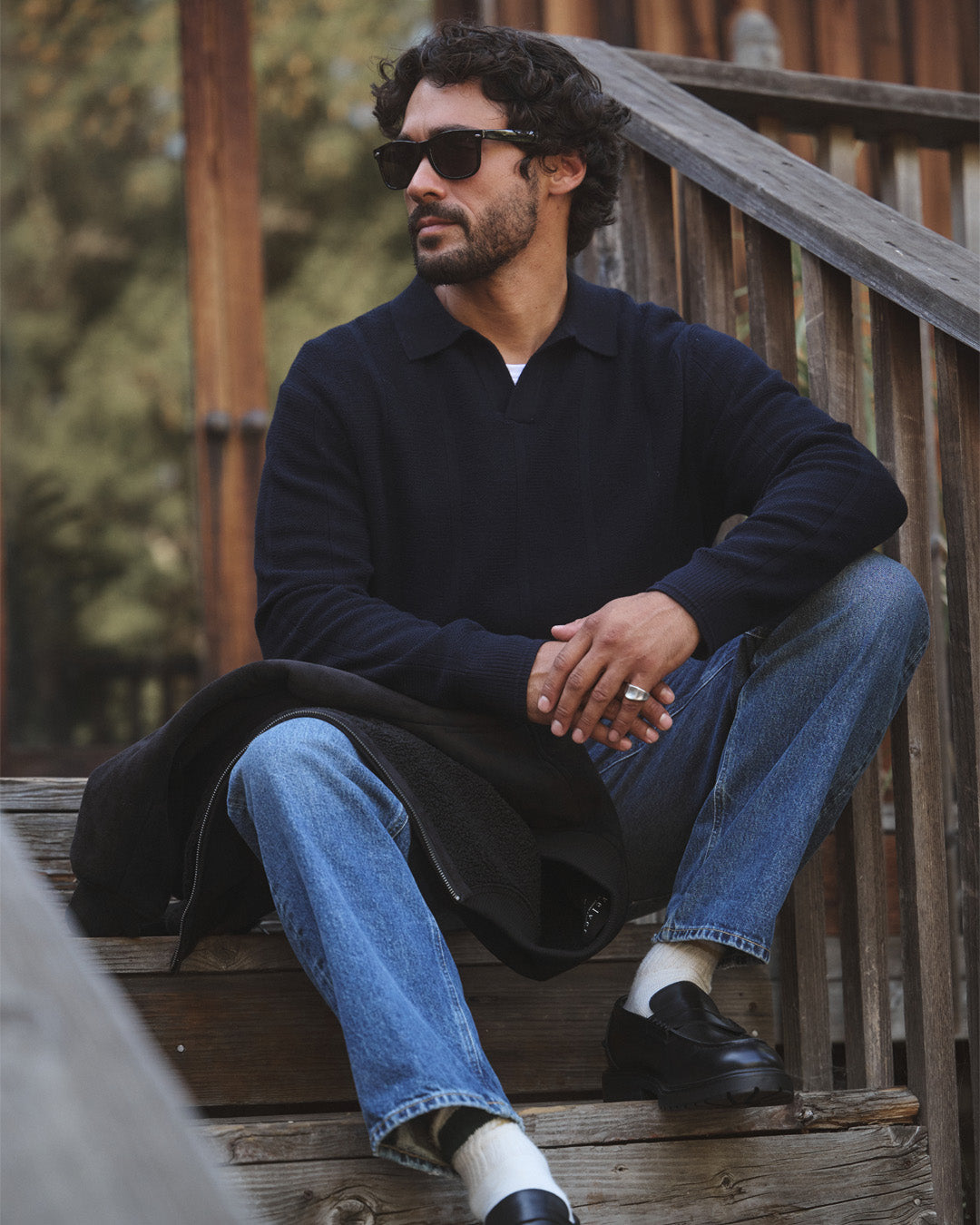 A man wearing the Redding Sweater by Velvet by Graham & Spencer.