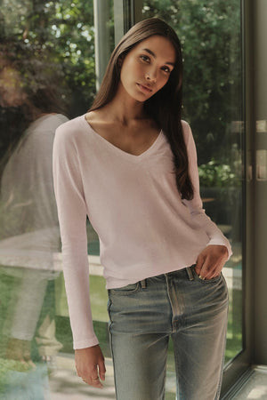 A woman wearing whisper-soft cotton jeans and a forever piece, the Velvet by Graham & Spencer BLAIRE ORIGINAL SLUB TEE.