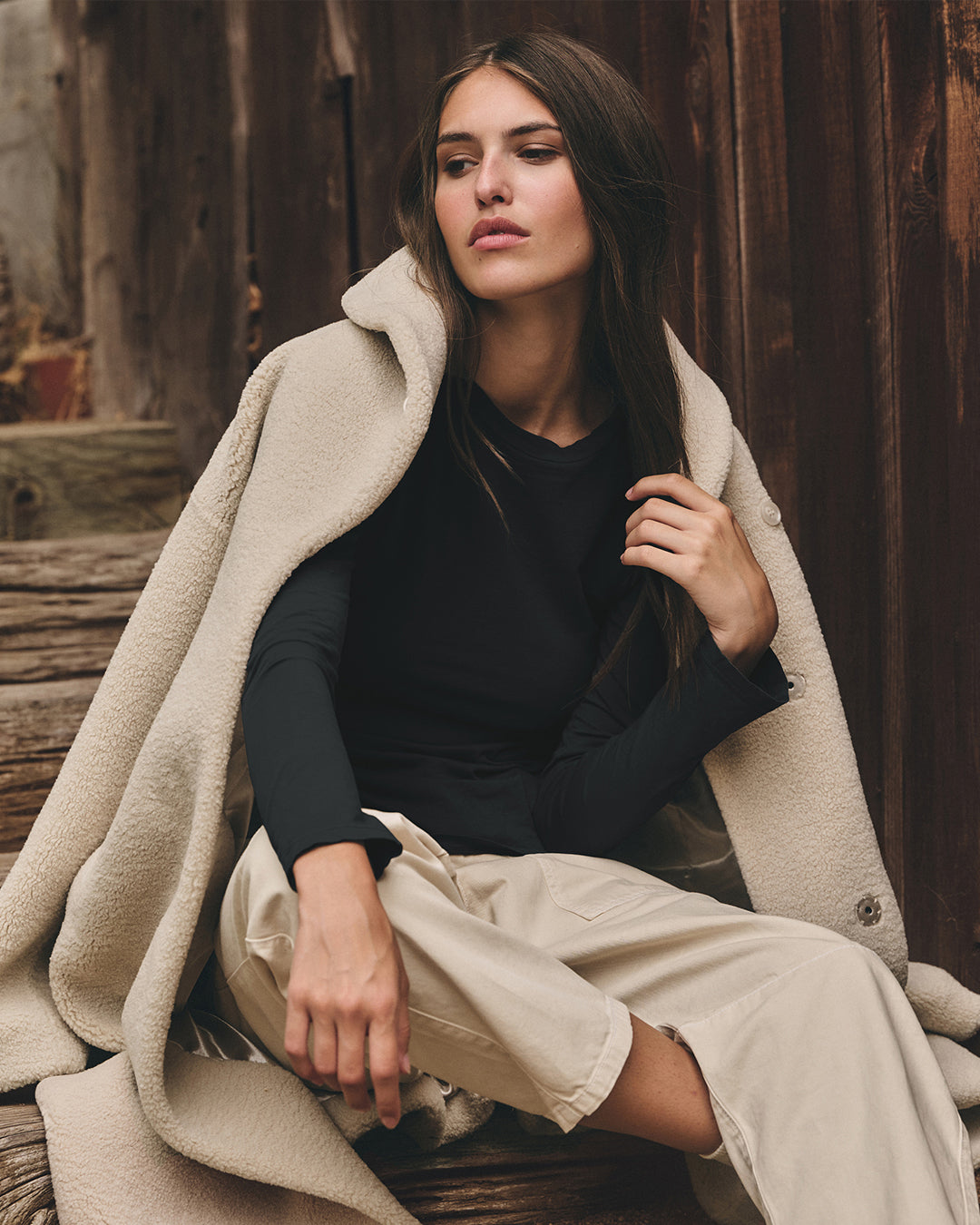 A woman wearing the Eleanor Coat by Velvet by Graham & Spencer.