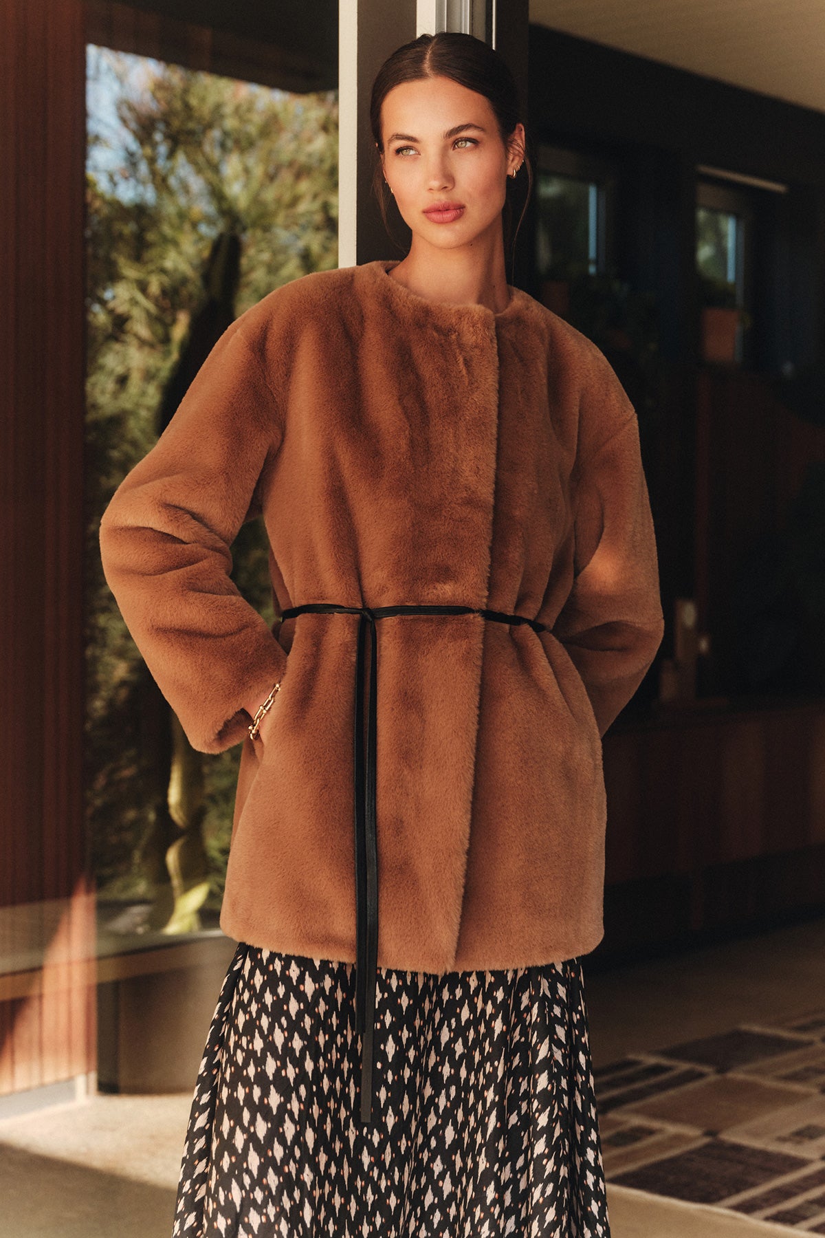 A woman wearing the Marmont Coat by Velvet by Graham & Spencer.