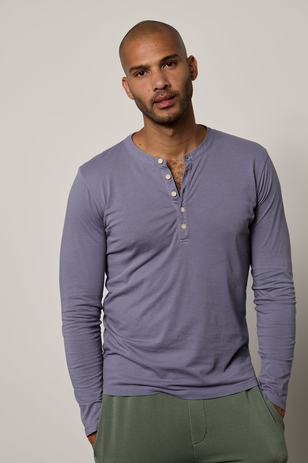 a man wearing a purple ALVARO COTTON JERSEY HENLEY henley t - shirt and green pants. Brand Name: Velvet by Graham & Spencer-26629718081729